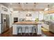 Modern kitchen showcasing a butcher block island, stainless steel appliances, and custom cabinetry at 4215 Ten Shillings Way, Ravenel, SC 29470