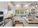 Spacious kitchen with butcher block island, stainless steel appliances, and views of the yard at 4215 Ten Shillings Way, Ravenel, SC 29470