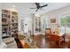 Living room has hardwood floors and built in shelving to display art, books, and photographs at 4215 Ten Shillings Way, Ravenel, SC 29470