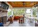 The expansive outdoor patio offers ample seating, a built-in bar, and a brick fireplace at 4215 Ten Shillings Way, Ravenel, SC 29470
