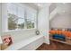 Cozy window seat with views of the water and a comfortable seating area adjacent at 4215 Ten Shillings Way, Ravenel, SC 29470