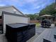 Relaxing backyard with hot tub, patio table and chairs, and outdoor space perfect for unwinding at 482 Planters Trace Dr, Charleston, SC 29412