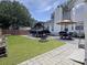 Picturesque backyard featuring a boat and trailer, inviting patio, and lush green lawn at 482 Planters Trace Dr, Charleston, SC 29412