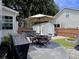 Backyard with a patio table and chairs, hot tub, lush grass and storage shed at 482 Planters Trace Dr, Charleston, SC 29412