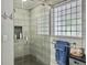 Bathroom showcasing a glass-enclosed shower with gray tile and a window for natural light at 482 Planters Trace Dr, Charleston, SC 29412