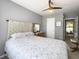 Cozy bedroom featuring soft patterned bedding, a decorative headboard, and serene gray walls at 482 Planters Trace Dr, Charleston, SC 29412