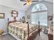 Bedroom features a large window, wood furniture, and a comfortable bed with an inviting quilt at 482 Planters Trace Dr, Charleston, SC 29412