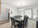 Formal dining room with stylish lighting, neutral decor, and a view towards entry at 482 Planters Trace Dr, Charleston, SC 29412