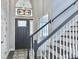 Inviting entryway featuring stained glass window above door and staircase on the right at 482 Planters Trace Dr, Charleston, SC 29412