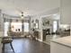 Open kitchen with tile floors, view to living room, and breakfast bar at 482 Planters Trace Dr, Charleston, SC 29412