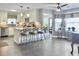 Bright kitchen with white cabinets, stainless steel appliances, and breakfast bar at 482 Planters Trace Dr, Charleston, SC 29412