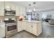 Modern kitchen with white cabinetry, stainless steel appliances, and open layout at 482 Planters Trace Dr, Charleston, SC 29412