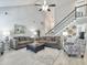 Bright living room with high ceilings, plush seating, and staircase at 482 Planters Trace Dr, Charleston, SC 29412