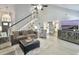 Open-concept living room featuring gray walls, plank floors, and comfortable furniture at 482 Planters Trace Dr, Charleston, SC 29412