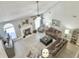 Open living area with hardwood flooring, fireplace, and comfortable seating, perfect for gatherings at 482 Planters Trace Dr, Charleston, SC 29412