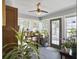 Cozy sunroom with lots of windows, tile floors, and space for plants at 482 Planters Trace Dr, Charleston, SC 29412