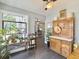 Sunroom features tile floors, windows, a ceiling fan, and lots of plants at 482 Planters Trace Dr, Charleston, SC 29412