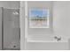 Relaxing bathroom featuring a soaking tub with window and separate glass enclosed shower at 4823 Shady Tree Ln, Summerville, SC 29485