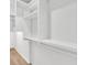 Walk-in closet with installed white storage and clothes rods, providing efficient storage at 4823 Shady Tree Ln, Summerville, SC 29485