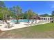 Enjoy the community pool surrounded by swaying palm trees and comfortable seating at 4823 Shady Tree Ln, Summerville, SC 29485