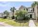 Charming townhome with a manicured front yard, lush greenery, and a welcoming entrance perfect for Southern living at 4823 Shady Tree Ln, Summerville, SC 29485