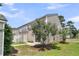 A multi-Gathering exterior with well maintained landscaping and a manicured lawn at 4823 Shady Tree Ln, Summerville, SC 29485