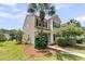 Charming two-story home with a well-manicured lawn and a beautiful palm tree at 4823 Shady Tree Ln, Summerville, SC 29485