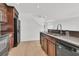 Open kitchen with stainless steel appliances and view into living room at 4823 Shady Tree Ln, Summerville, SC 29485
