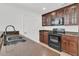Kitchen view featuring dark cabinets and stainless steel appliances at 4823 Shady Tree Ln, Summerville, SC 29485