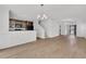 Spacious living room with hardwood floors, chandelier, and adjacent kitchen at 4823 Shady Tree Ln, Summerville, SC 29485