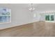 Spacious living area showcasing hardwood floors, wainscoting detail, and lots of natural light, perfect for entertaining and relaxing at 4823 Shady Tree Ln, Summerville, SC 29485