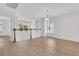 Bright loft area with hardwood floors, white walls, a chandelier, and multiple windows at 4823 Shady Tree Ln, Summerville, SC 29485