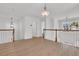 View of a loft with wood floors, chandelier and white railing and banister at 4823 Shady Tree Ln, Summerville, SC 29485