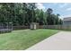 Large backyard featuring a trampoline, shed and privacy fence at 5094 Thornton Dr, Summerville, SC 29485