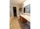 Bathroom featuring a walk-in shower, wood-stained cabinets, and a large mirror over the vanity at 5094 Thornton Dr, Summerville, SC 29485