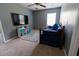 Cozy bedroom featuring a daybed, TV, and colorful rug at 5094 Thornton Dr, Summerville, SC 29485