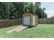 Backyard featuring a shed with roll up door at 5094 Thornton Dr, Summerville, SC 29485