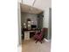 Home office space with an executive desk and red leather chair at 5094 Thornton Dr, Summerville, SC 29485