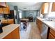 Well-lit kitchen with stainless steel appliances, wooden cabinets, and an eat-in dining area at 5094 Thornton Dr, Summerville, SC 29485