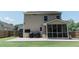 Backyard with outdoor patio, grill and screened in porch at 5094 Thornton Dr, Summerville, SC 29485