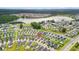 An aerial view showcases a home's location in a community near a lake at 512 Alderly Dr, Moncks Corner, SC 29461