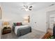 Calm bedroom with a ceiling fan and plush gray bedding complemented by soft lighting for a serene and inviting space at 512 Alderly Dr, Moncks Corner, SC 29461