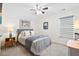 Cozy bedroom features a comfortable bed with stylish bedding, complemented by natural light from the window at 512 Alderly Dr, Moncks Corner, SC 29461