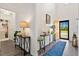 Open-concept entryway with laminate floors, leading to living spaces; laundry room access visible at 512 Alderly Dr, Moncks Corner, SC 29461