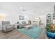 Bright living room featuring stylish decor, a ceiling fan, and an open layout at 512 Alderly Dr, Moncks Corner, SC 29461
