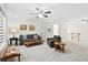 Spacious living room with comfortable seating, a ceiling fan, and neutral carpeting at 512 Alderly Dr, Moncks Corner, SC 29461