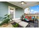 Inviting covered patio with comfortable seating, stylish decor, and a view of the backyard, perfect for relaxation at 512 Alderly Dr, Moncks Corner, SC 29461