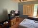 Bedroom with a window and multiple tv's needing organization at 516 Arlington Dr # B5, Charleston, SC 29414
