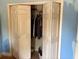 Open closet with hanging clothes. Shows the storage space available at 516 Arlington Dr # B5, Charleston, SC 29414