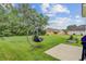 Expansive backyard view complete with a hanging swing and tidy landscaping at 520 Crossland Dr, Moncks Corner, SC 29461